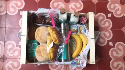 a box filled with different types of breakfast foods at Liiiving in Porto | Art & Heart Studio in Porto