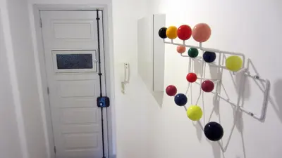 a bunch of balloons on a wall next to a door at Casa da Catedral in Porto