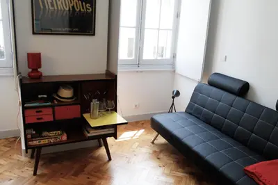 a living room with a couch and a table at Casa da Catedral in Porto