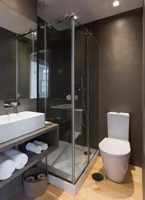 a bathroom with a shower and a toilet and a sink at Seventyset Flats - Porto Historical Center in Porto