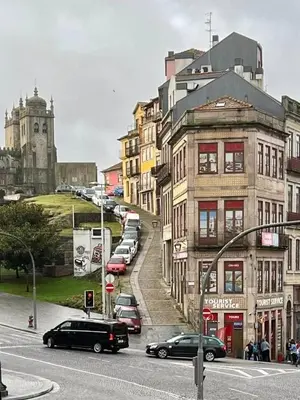 a city street with cars parked on the street at OPO Trinta e um in Porto