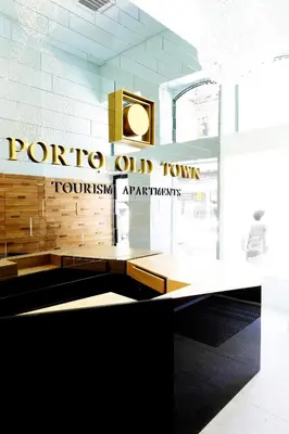a bedroom with a large bed with yellow pillows at Porto Old Town – Tourism Apartments in Porto