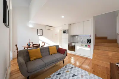 a living room with a couch and a table at Apartment Firehouse by Sweet Porto - Free Parking in Porto