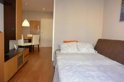 a bedroom with a bed and a dining room at Júlio Dinis Flat, by Flat in Porto in Porto