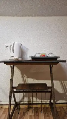 a table with a plate and dishes on it at Suite Porto in Porto