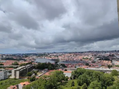 a view of a city with a river and buildings at Douro View Apartment in Vila Nova de Gaia