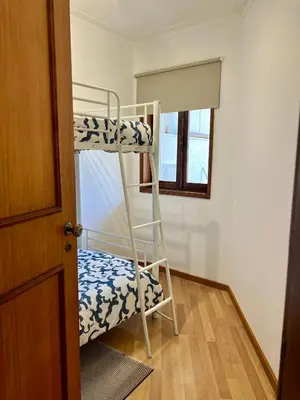 a bunk bed in a room with a ladder at Douro & Sea - River Side in Vila Nova de Gaia
