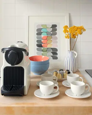 a kitchen counter with cups and a coffee maker at Own Places Clérigos Apartments in Porto