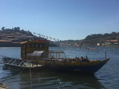 a group of people on a boat in the water at PortoVivo Bonjardim Apartamento in Porto