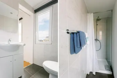 a bathroom with a toilet sink and a shower at PortoVivo Bonjardim Apartamento in Porto