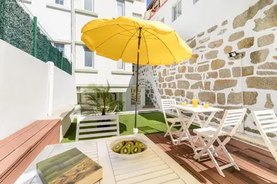 a bedroom with a bed with two towels on it at Antero Quental Residence in Porto