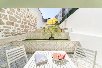 a bedroom with a bed with two towels on it at Antero Quental Residence in Porto