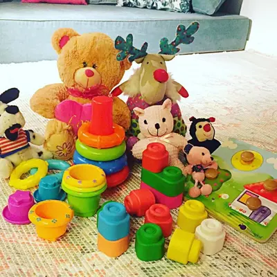 a group of stuffed animals and toys on a bed at Janika's Apartment in Porto