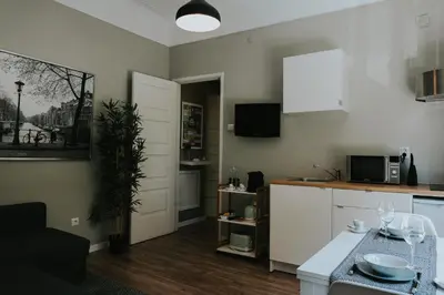 a kitchen with white cabinets and a counter top at Five Seven Nine Apartments in Porto