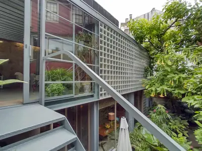 an external view of a house with a balcony and stairs at Garden House in Porto
