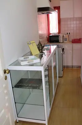 a kitchen with a glass counter top in a kitchen at The Yellow House in Vila Nova de Gaia