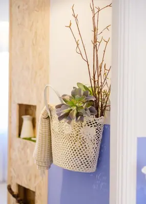 a wicker basket with a plant in it on a wall at BOUTIQUE RENTALS - Provence Apartment in Porto