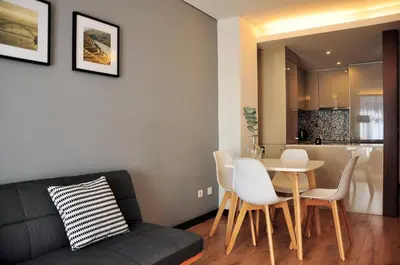 a living room with a couch and a table and chairs at PicPorto Apartment in Porto