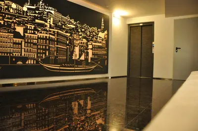 a room with a large painting on the wall at PicPorto Apartment in Porto