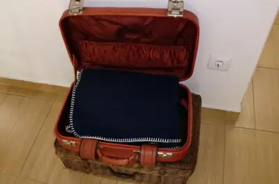 a suitcase sitting on top of a basket at The Yellow House 2 in Porto