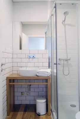 a bathroom with a sink and a shower at Spot Apartments Ceuta in Porto