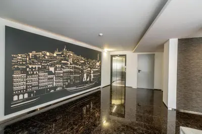 a hallway with a wall mural of a city at Merc Porto Santa Catarina in Porto