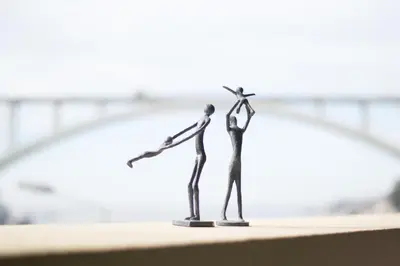 two figurines of a man and woman standing next to each other at Merc Porto Santa Catarina in Porto