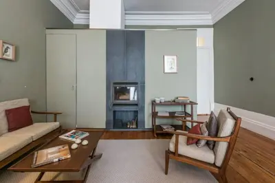 a living room with a couch and a table at GuestReady - Picaria Living Quarters in Porto