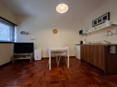 a living room with a table and a dining room at Studio 312 - With Free Parking in Porto