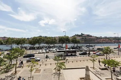 a parking lot with cars parked in a parking lot at Goabio Studio River View in Porto