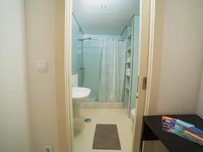 a bathroom with a shower and a toilet and a sink at OPORTO GUEST - Cedofeita in Porto