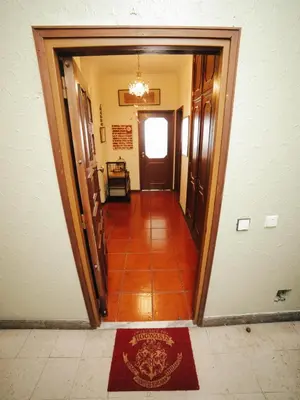 a hallway with a door and a tile floor at OPORTO GUEST Harry Potter flat with Parking in Porto