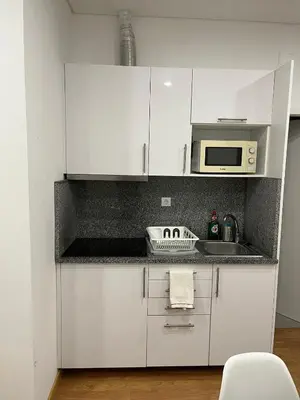 a small bed in a room with a window at Down Bonjardim Apartments in Porto