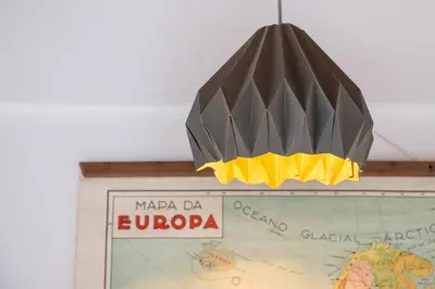 a chandelier hanging over a map of europe at Home in Porto - Cozy 2BR Duplex by LovelyStay in Porto