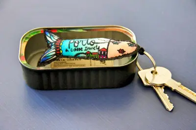 a small container with a small key in it at Andorinha Apartment in Porto