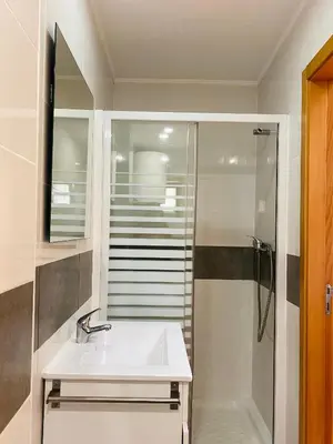 a bathroom with a sink and a shower at Casa Devesas in Vila Nova de Gaia