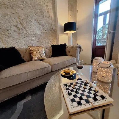a large bedroom with a large bed in a attic at Oporto Golden Apartment in Porto