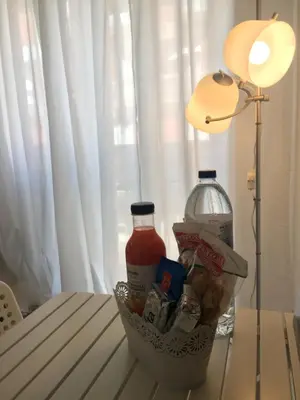 a table with a basket of food and a lamp at Apartamento Da Lapa in Porto