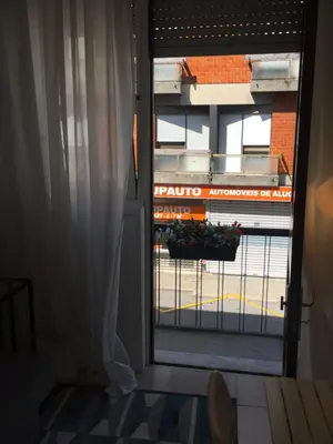 an open window with a view of a building at Apartamento Da Lapa in Porto