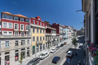 a view of a city street with cars parked at Mouzinho 244 - Porto Houses & Suites in Porto