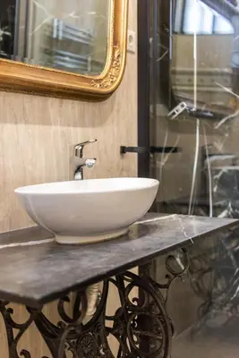 a white sink on a counter in a bathroom at Casa das Musas in Porto