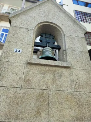 a bell sticking out of the side of a building at Abbey Apartments City Center Bolhão in Porto