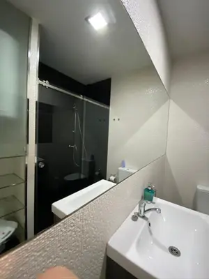 a bathroom with a sink and a mirror at AP da Baixa in Porto