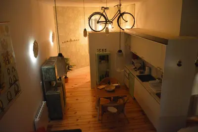 a kitchen with a bike hanging from the ceiling at Oporto Old In New in Porto