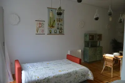 a bedroom with a bed and a desk and a table at Oporto Old In New in Porto