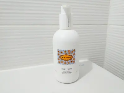 a white bottle of sunscreen sitting on a table at H2O Porto Ribeira in Porto