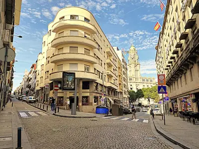 a tall building on a city street with buildings at PORTO SWEETHEART - Almada in Porto