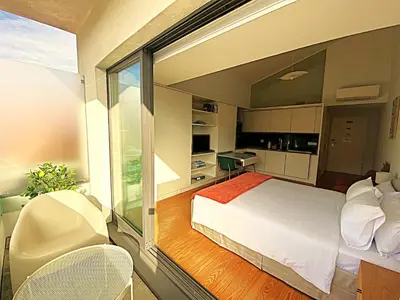 a bedroom with a bed and a large window at PORTO SWEETHEART - Almada in Porto