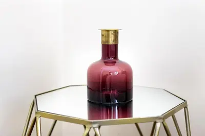 a bottle of wine sitting on a glass table at Chateau Belomonte in Porto