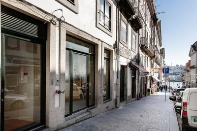 a row of windows on a building on a street at Loft 72 in Porto